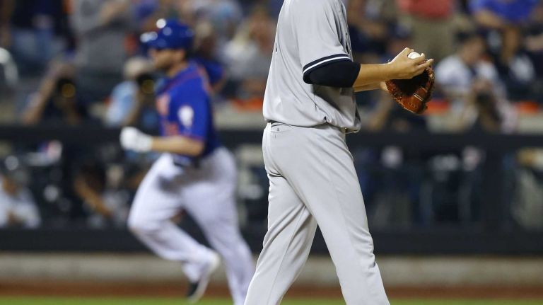 Subway Series: Yankees vs. Mets 84 Masahiro Tanaka of the New York Yankees looks on after surrendering a sixth-inning home run against Daniel Murphy of the New York Mets at Citi Field on Friday, Sept. 18, 2015.