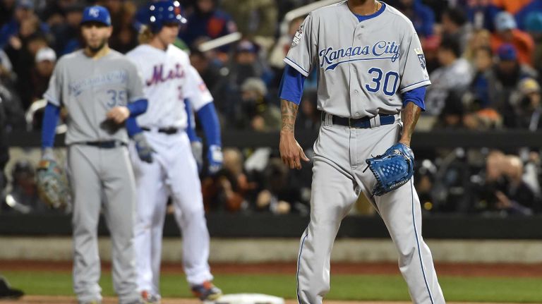 Kansas City Royals starting pitcher Yordano Ventura reacts to the hit by New York Mets starting pitcher Noah Syndergaard in third inning during Game 3 of the World Series against the New York Mets at Citi Field on Friday, Oct. 30, 2015.