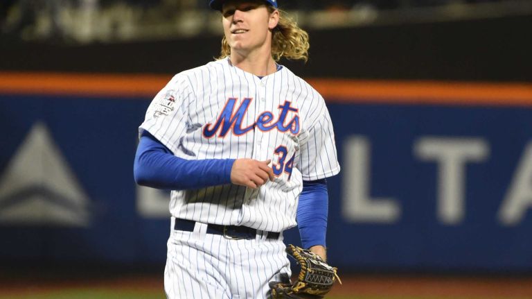 New York Mets starting pitcher Noah Syndergaard reacts in the third inning during Game 3 of the World Series against the Kansas City Royals at Citi Field on Friday, Oct. 30, 2015.