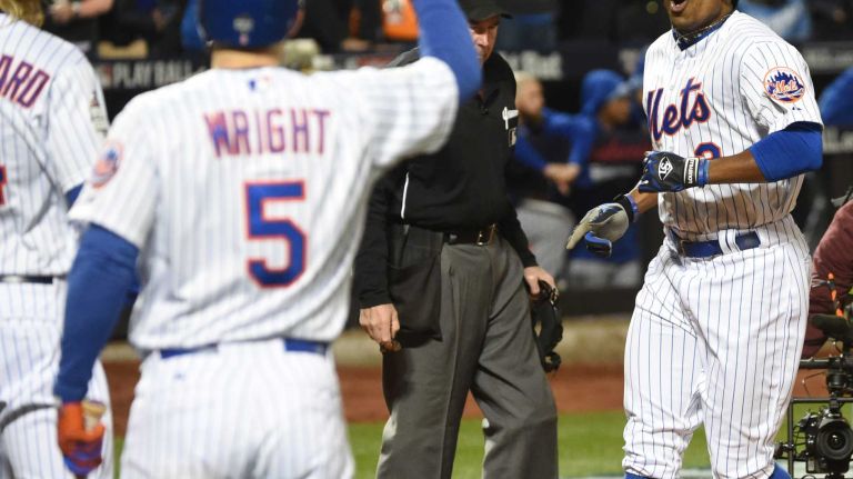 New York Mets right fielder Curtis Granderson reacts as he gets to home plate after his third inning home run during Game 3 of the World Series against the Kansas City Royals at Citi Field on Friday, Oct. 30, 2015.