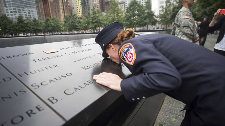 NYC Firefighter Josephine Smith remembers her father, Firefighter Kevin Smith, as friends and families gather at Ground Zero on Sept. 11, 2015 to honor and remember those killed 14 years ago.