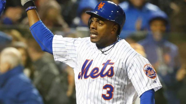 New York Mets rightfielder Curtis Granderson is high-fived by David Wright and Noah Syndergaard during Game 3 of the World Series against the Kansas City Royals at Citi Field on Friday, Oct. 30, 2015.