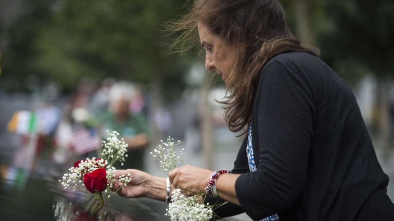 Vicki Tureski remembers her brother in law, Steve Pollicino, a Cantor Fitzgerald employee who died during the Sep 11 terror attacks on NYC. Friends and families gathered at Ground Zero on Sept. 11, 2015 to honor and remember those lost 14 years ago.