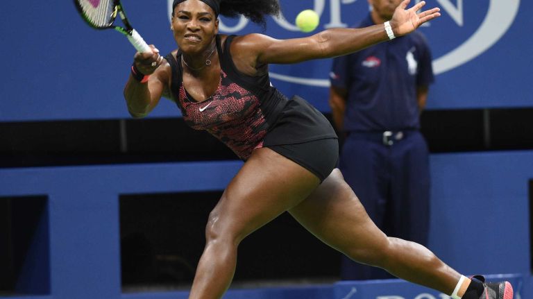 Serena Williams returns to Venus Williams during the women's singles quarterfinals at the U.S. Open tennis tournament on Tuesday, Sept. 8, 2015.