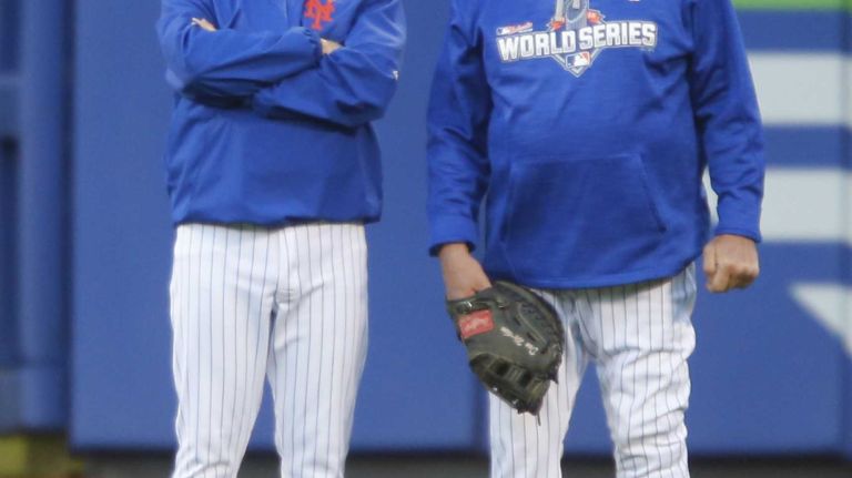 New York Mets manager Terry Collins and New York Mets pitching coach Dan Warthen in the outfield during batting practice of Game 3 of the World Series against the Kansas City Royals at Citi Field on Friday, Oct. 30, 2015.