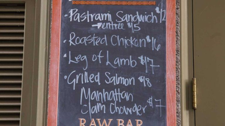 Ulysses' lists specials on a chalk board in Manhattan's Financial District on Aug. 20, 2015.