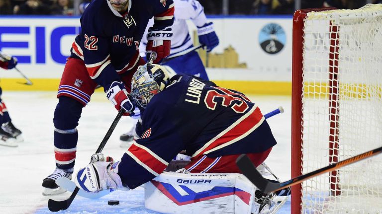 New York Rangers goalie Henrik Lundqvist (30) makes the save against the Toronto Maple Leafs during the second period of a game at Madison Square Garden on Friday, Oct. 30, 2015.