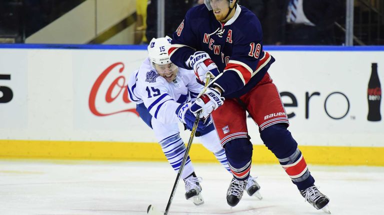 New York Rangers defenseman Marc Staal (18) is pursued by Toronto Maple Leafs right wing P.A. Parenteau (15) during the second period of a game at Madison Square Garden on Friday, Oct. 30, 2015.