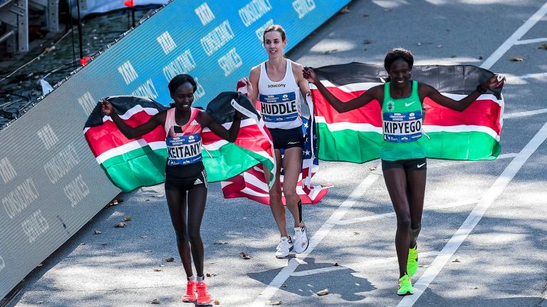 The top three women's finishers of the TCS New York City Marathon run side by side on a victory lap on Nov. 6, 2016.
