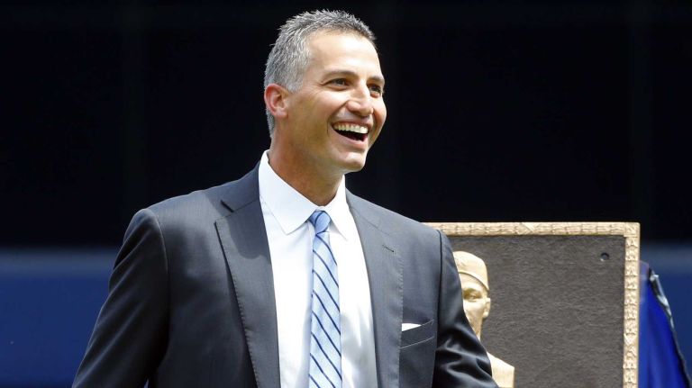 Andy Pettitte stands next to his Monument Park plaque during a ceremony before a game between the New York Yankees and the Cleveland Indians at Yankee Stadium on Sunday, Aug. 23, 2015.