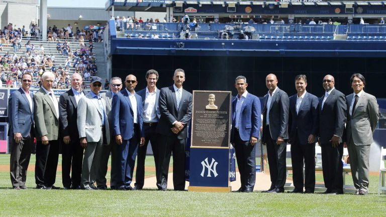Andy Pettitte poses for a photograph with his Monumment Park plaque along side former teammates, coaches and trainers before the Yankees play against the Cleveland Indians at Yankee Stadium on Sunday, Aug. 23, 2015.