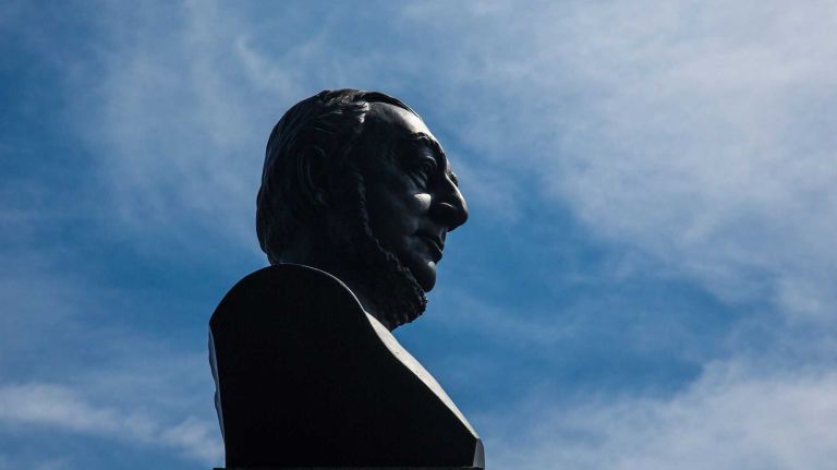 College Point, Queens 32 At Poppenhusen Triangle a bust of Conrad Poppenhusen is on a pedestal. City Living in the neighborhood of College Point in Queens.August 7, 2015