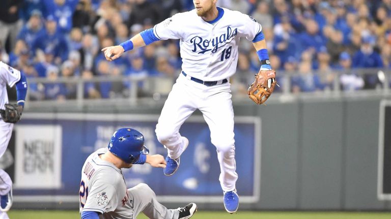 World Series Game 2: Mets vs. Royals 57 New York Mets first baseman Lucas Duda (21) is out at 2nd base as Kansas City Royals second baseman Ben Zobrist (18) gets out of way to complete the double play on New York Mets catcher Travis d'Arnaud (7) in second inning during Game 2 of the World Series against the Kansas City Royals at Kauffman Stadium on Wednesday, Oct. 28, 2015.