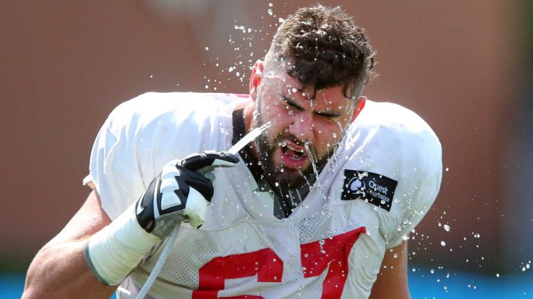 New York Giants tackle Justin Pugh takes a drink during training camp at the Quest Diagnostics Training Center in East Rutherford, N.J., on Sunday, Aug. 2, 2015.