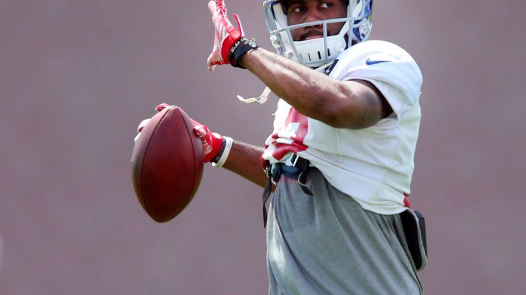 New York Giants wide receiver Derrick Johnson #18 throws a ball during training camp at the Quest Diagnostics Training Center in East Rutherford, N.J., on Sunday, Aug. 2, 2015.
