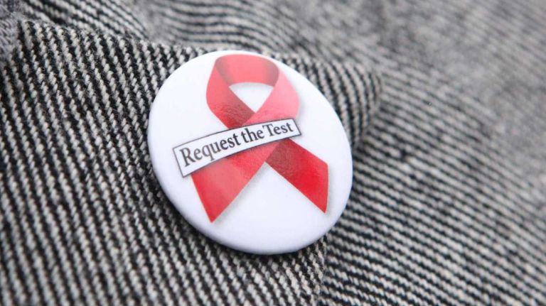 Over 1,700 free HIV self-test kits were handed out to city residents last year, the health department said. Above, Carlos Manuel Gonzalez,  of Yonkers,  wears a 