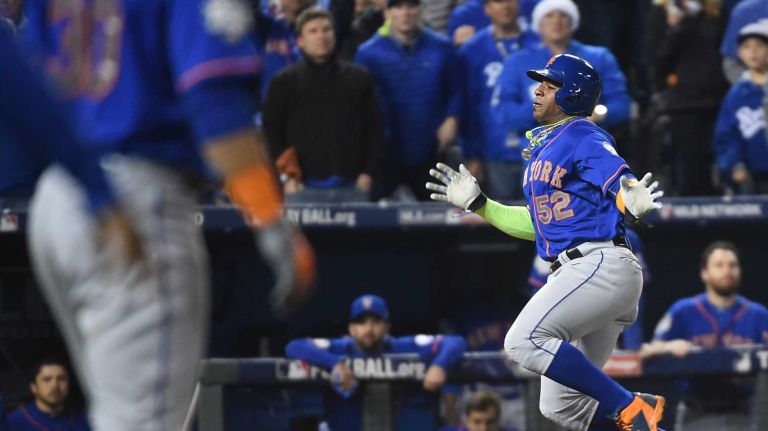 World Series Game 1: Mets vs. Royals 105 New York Mets center fielder Yoenis Cespedes (52) scores on sac fly in the sixth inning on the ball hit by New York Mets left fielder Michael Conforto (30) during Game 1 of the World Series against the Kansas City Royals at Kauffman Stadium on Tuesday, Oct. 27, 2015.