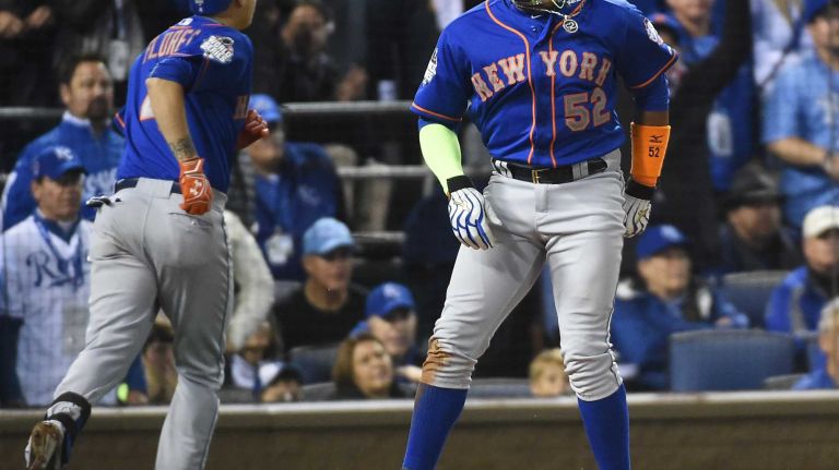 World Series Game 1: Mets vs. Royals 106 New York Mets center fielder Yoenis Cespedes (52) scores on sac fly in the sixth inning on the ball hit by New York Mets left fielder Michael Conforto (30) during Game 1 of the World Series against the Kansas City Royals at Kauffman Stadium on Tuesday, Oct. 27, 2015.