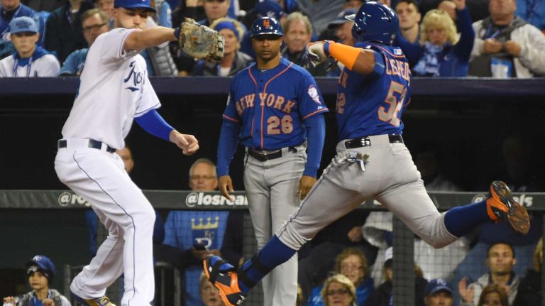 World Series Game 1: Mets vs. Royals 108 New York Mets center fielder Yoenis Cespedes (52) is out at 1st base in the second inning as Kansas City Royals first baseman Eric Hosmer (35) steps on base during Game 1 of the World Series against the Kansas City Royals at Kauffman Stadium on Tuesday, Oct. 27, 2015.