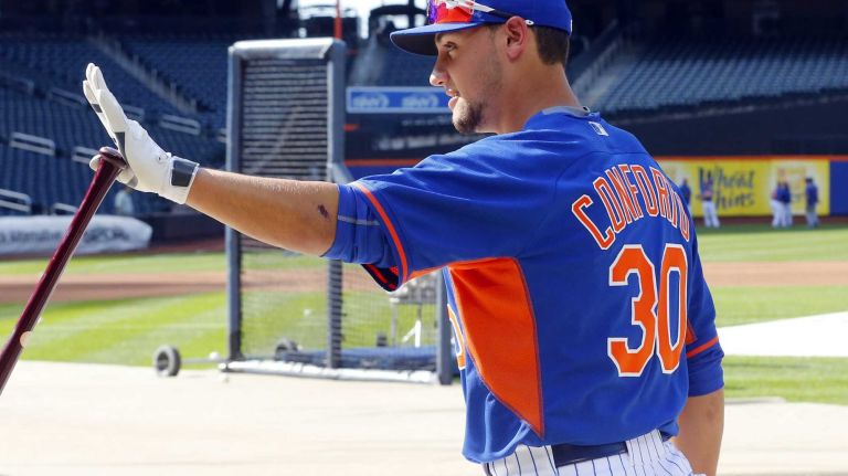 Michael Conforto of the Mets warms up before a game against the Los Angeles Dodgers at Citi Field on Friday, July 24, 2015.
