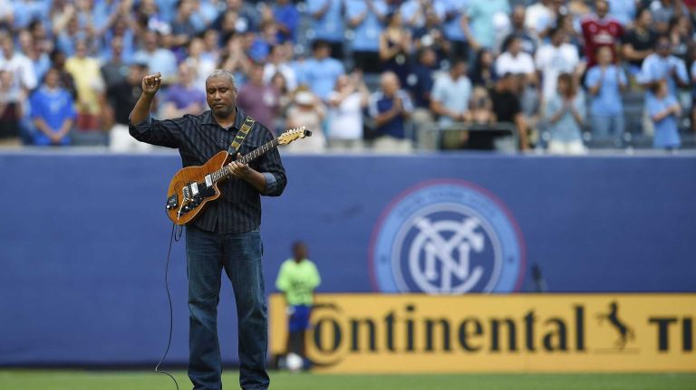 Former New York Yankees centerfielder Bernie Williams plays the national anthem before an MLS game between the New York City FC and the Orlando City FC at Yankee Stadium on Sunday, July 26, 2015.