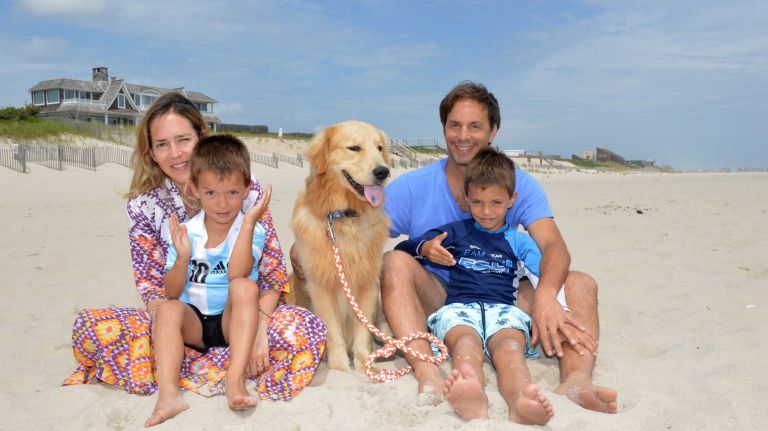 Claudia and Carlos Rohm hang out with their sons Santiago and Carlos, and dog Tango at Ocean Road Beach in Bridgehampton, on Saturday July 4, 2015.