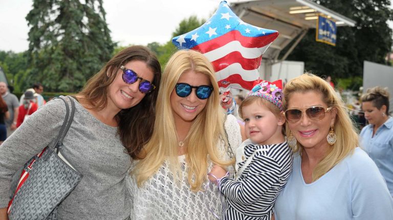 Lara Charno, Blake Goldberg, Avery Goldberg and Michelle Walker at the Fourth of July parade on Saturday, July 4, 2015, in Southampton.