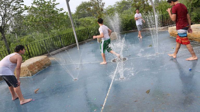 Bergen Beach 34 Friends play tag in the sprinklers at Joseph T. McGuire Park on Bergen Ave. near the Belt Parkway in Bergen Beach, Brooklyn, July 3, 2015.