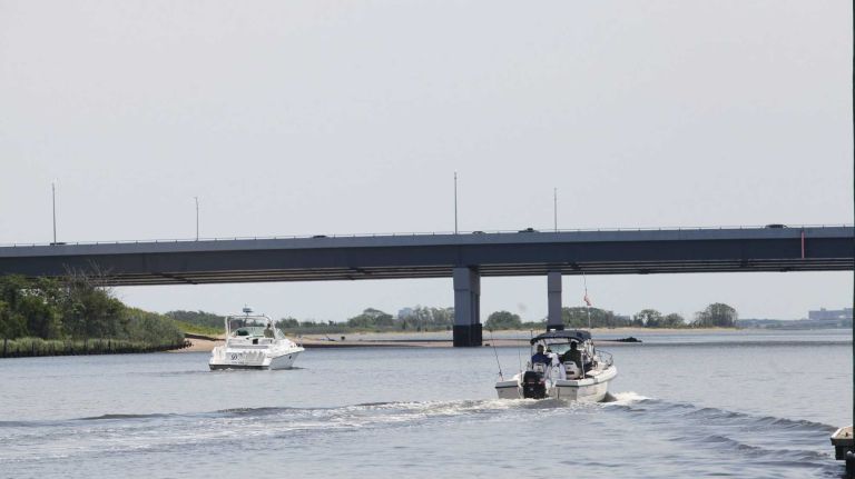 Bergen Beach 38 Boaters in the Paerdegast Basin with the Belt Parkway in the background in Bergen Beach, Brooklyn, July 3, 2015.