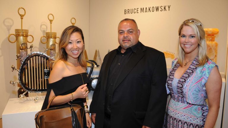Mary Lai, Habib Saba and Ellen Hunter attend the opening Thursday, July 2, 2015, of ArtHamptons in Bridgehampton.