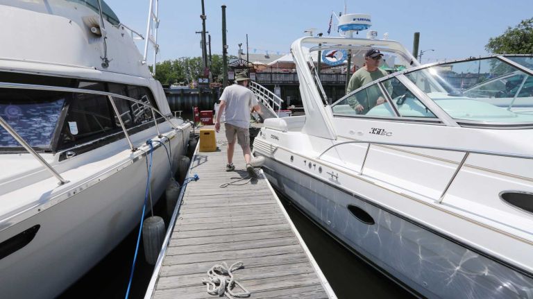 Bergen Beach 49 Joe Chiodo, left, helps boaters at the Hudson River Yacht Club at 2101 Bergen Ave. in Bergen Beach, Brooklyn, July 3, 2015.