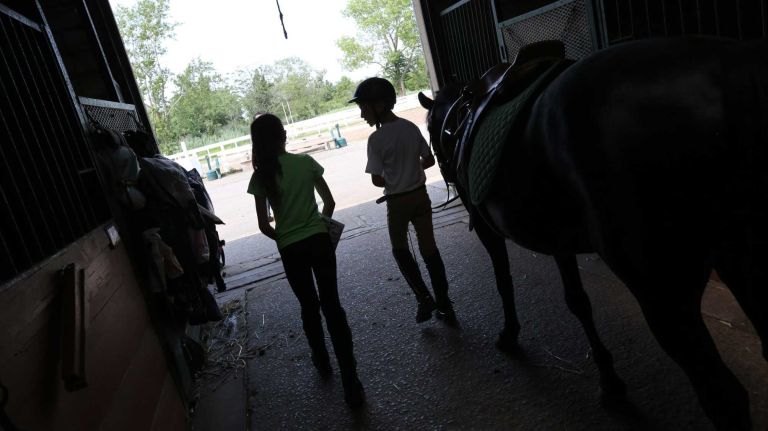 Bergen Beach 53 Children in the stables of the Jamaica Bay Riding Academy, in Bergen Beach, Brooklyn, July 3, 2015.