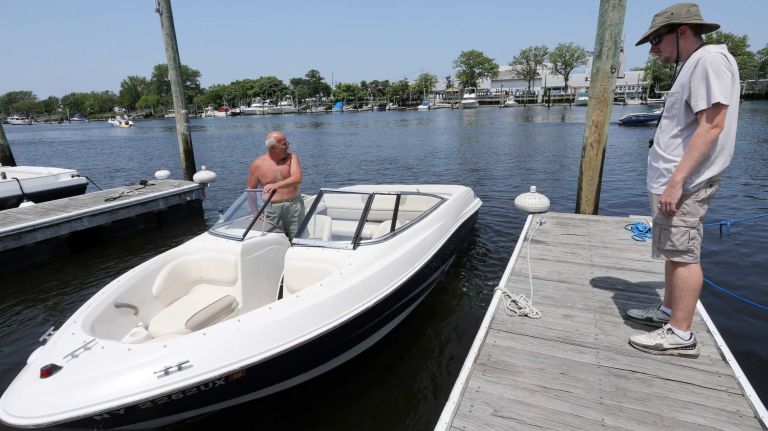 Bergen Beach 54 Tommy Panchianco, backs his boat out of the Hudson River Yacht Club in Bergen Beach, Brooklyn, July 3, 2015.