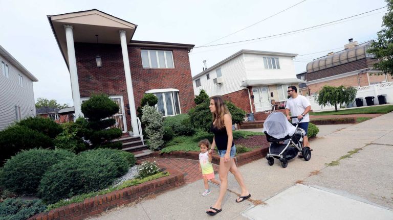 Bergen Beach 60 Danielle and Frank Balsamo, with daughter, Isabella, and son, Frand Jr. walk along E. 72 street between Ave. W and Ave. X in Bergen Beach, Brooklyn, July 3, 2015.