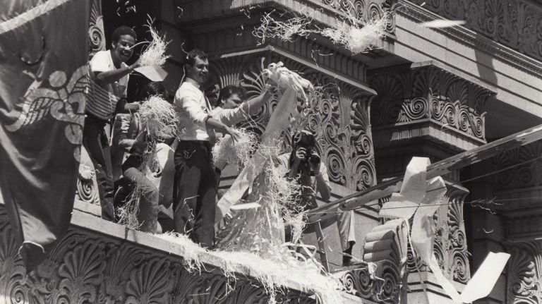 Workers at a firm just north of U.S. Customs House contribute confetti to the parade in honor of U.S. Olympians down the Canyon of Heroes on Broadway in lower Manhattan. (Aug. 15, 1984)