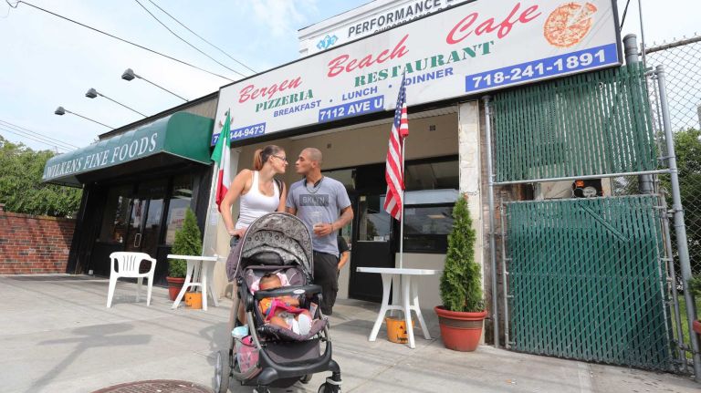 Bergen Beach 62 Michael Berger, Jessica Yigael, and daughter, Annalise, outside the Bergen Beach Cafe at 7112 Ave. U in Bergen Beach, Brooklyn, July 3, 2015.