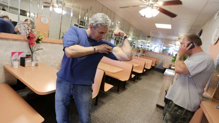 Bergen Beach 66 Anthony Di Pasqua shows off his biceps at the Bergen Beach Cafe at 7112 Ave. U in Bergen Beach, Brooklyn, July 3, 2015.