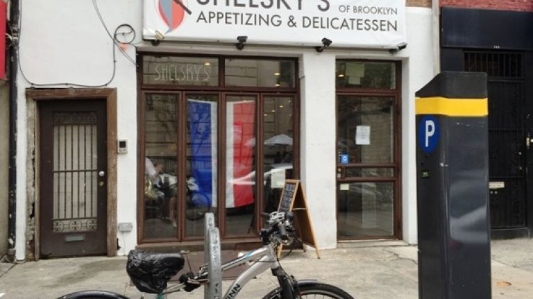 Explore a Block: Eat like a Brooklyn native on Court Street 5 The old school-style delicatessen has every salad and specialty food you remember from your Jewish childhood. Rows and rows of flavored cream cheeses, egg salad, lobster salad, baked salmon, schmaltz fried potato latkes and bowls of chopped liver will appeal to even the most discerning memories and palates. Grab a hot pastrami or corned beef sandwich, a baked knish and a pickle and you?re on your way. The white-tiled counter and chalkboard menu really drive home the vintage appeal. Where: 141 Court St. Contact: 718-855-8817; shelskys.com