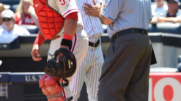 Yankees vs. Phillies 32 New York Yankees manager Joe Girardi speaks with home plate umpire Brian O'Nora as Philadelphia Phillies catcher Carlos Ruiz looks on during the first inning of a game at Yankee Stadium on Wednesday, June 24, 2015.