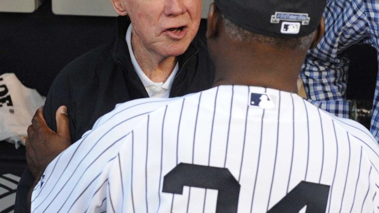 Former New York Yankees Whitey Ford speaks with Jim Coates in the dugout during the 69th Old-Timers' Day at Yankee Stadium before a baseball game between the Yankees and the Detroit Tigers on Saturday, June 20, 2015.