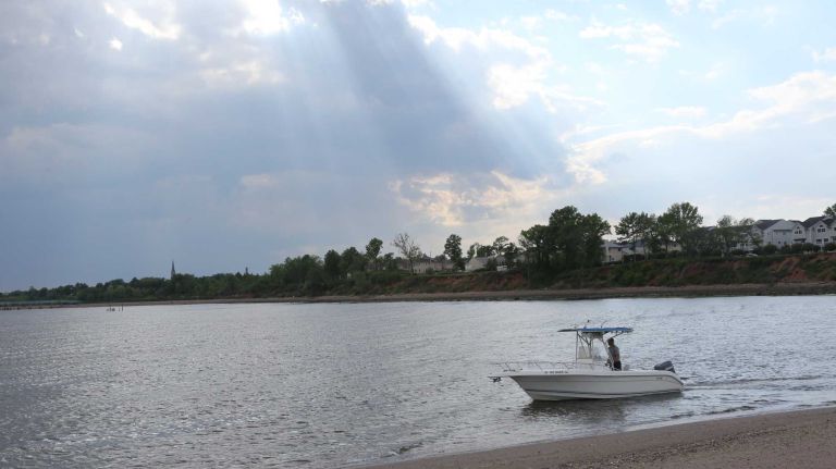 A boat on the bay from the shore in Lemon Creek Park in Prince's Bay, Staten Island, Friday, May 22, 2015.