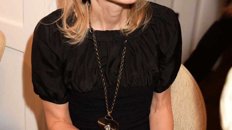 Author Wednesday Martin signs a book during a party on Saturday, June 6, 2015, for 