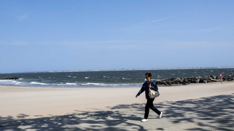Residents walk at Manhattan Beach on June 8, 2015. ?By Yeong-Ung Yang
