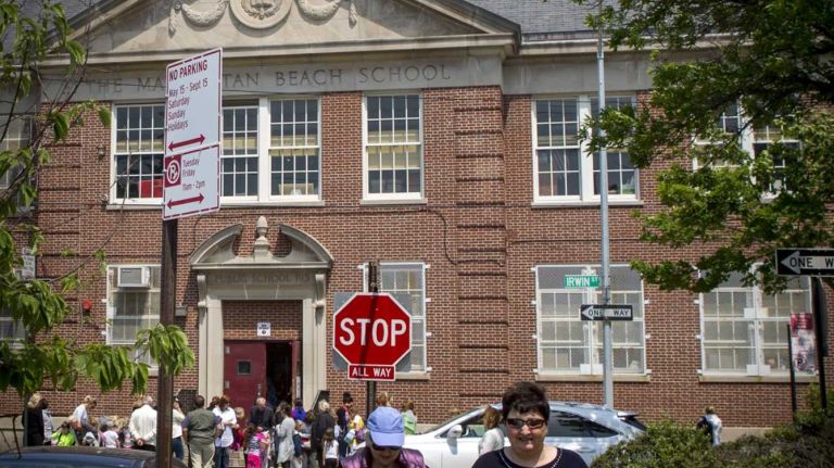 Guardians pick up students after school in front of P.S. 195, Manhattan Beach School, at Manhattan Beach, New York, on June 8, 2015. ?By Yeong-Ung Yang
