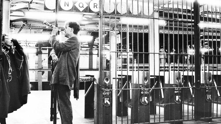 Commuters take advantage of the free subway fare just hours before midnight on New Year's Eve in a Times Square subway station. (Dec. 31, 1985)