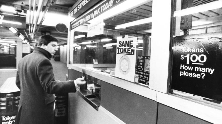 A downtown passenger deliberates over his Ten-Pak as he prepares to pay the new $1 fare during the morning rush hour at the West 72nd Street and Broadway IRT station. (Jan. 2, 1986)