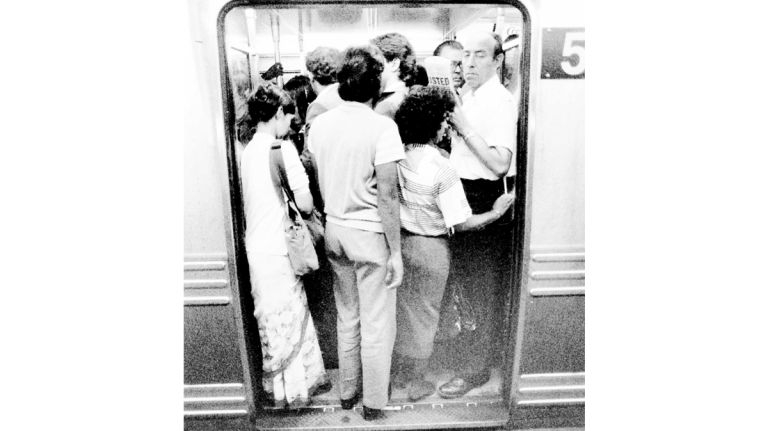 Riders cram into a subway car on the E and F lines at the Third Avenue and 53rd Street station. (Sept. 9, 1987)