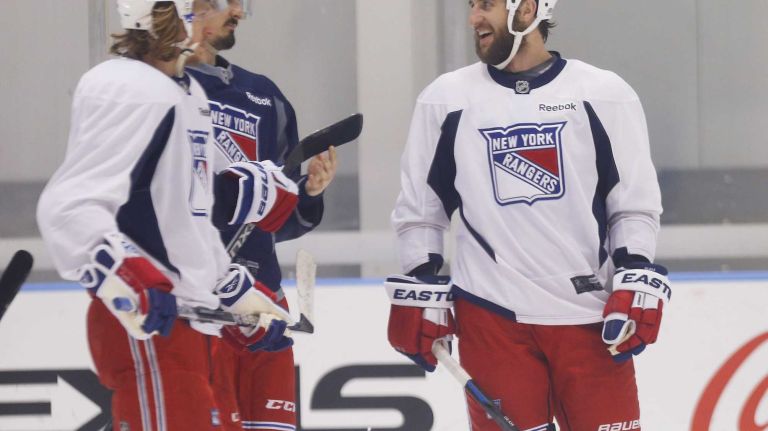 Chris Kreider, Carl Hagelin and Tanner Glass of the Rangers talk during practice on Thursday, May 28, 2015 at the MSG Training Center in Greenburgh, N.Y.