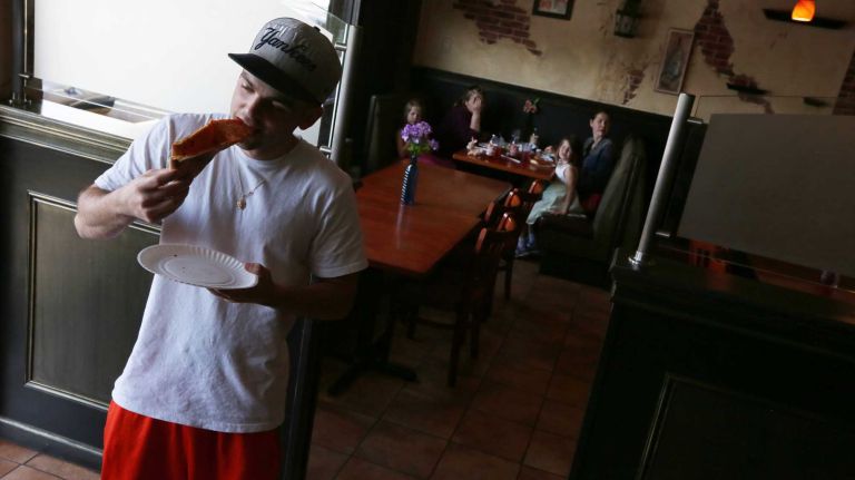 Gerard Gannon eats pizza at Fratelli Pizza at 27 Seguine Ave. in Prince's Bay, Staten Island, Friday, May 22, 2015.