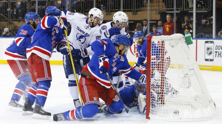 Tyler Johnson #9 of the Tampa Bay Lightning scores a second-period goal past Henrik Lundqvist #30 of the New York Rangers during Game 2 of the Eastern Conference finals at Madison Square Garden on Monday, May 18, 2015.